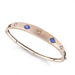 NO RESERVE - AN ANTIQUE SAPPHIRE AND DIAMOND BANGLE in yellow gold, the hinged bangle set with tw...