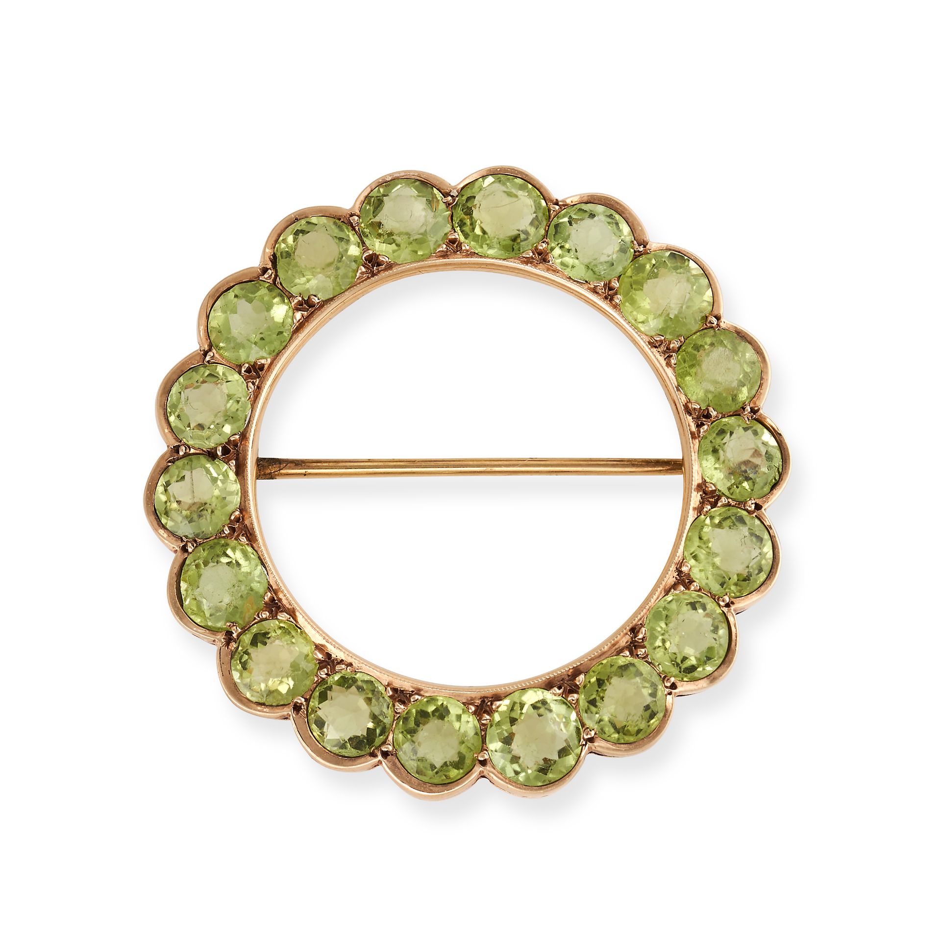 NO RESERVE - A PERIDOT CIRCLE BROOCH in yellow gold, set all around with a row of round cut perid...