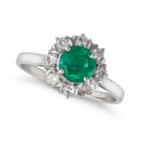 NO RESERVE - AN EMERALD AND DIAMOND CLUSTER RING in white gold, set with a round cut emerald in a...