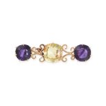 NO RESERVE - AN ANTIQUE AMETHYST AND CITRINE BAR BROOCH in yellow gold, set with a cushion cut ci...