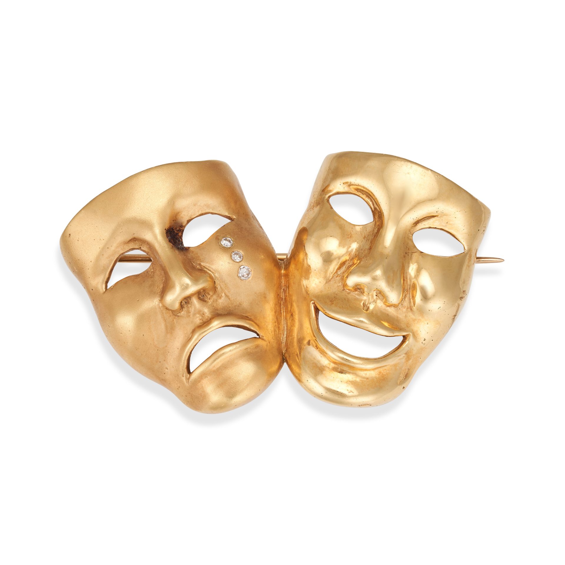 A DIAMOND COMEDY AND TRAGEDY MASK BROOCH in yellow gold, designed as the Comedy and Tragedy Masks...