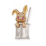 A DIAMOND AND RUBY RABBIT IN A MAGIC HAT BROOCH in 18ct yellow and white gold, designed as a rabb...