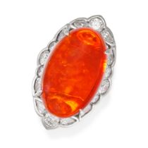 AN EXCEPTIONAL FIRE OPAL AND DIAMOND CLUSTER RING in platinum, set with an oval cabochon fire opa...