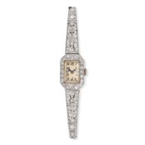 A VINTAGE DIAMOND COCKTAIL WATCH in platinum, manual wind movement, the rectangular dial with Ara...