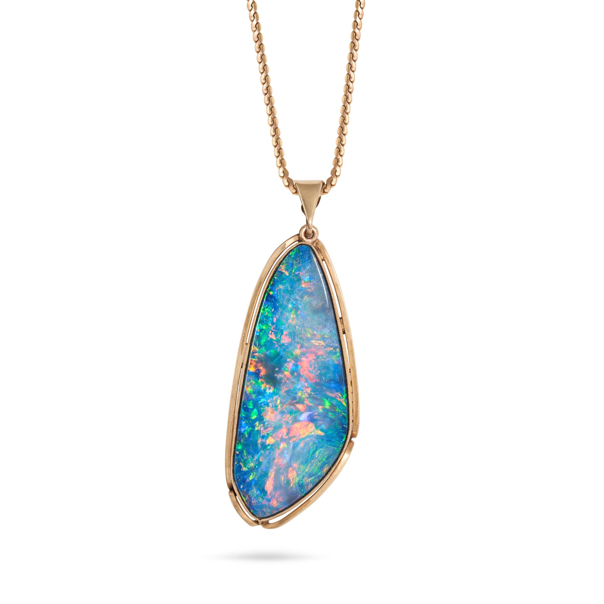 AN OPAL PENDANT NECKLACE in yellow gold, the pendant set with a cabochon opal, suspended from a f...