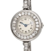 A DIAMOND COCKTAIL WATCH in platinum, the circular dial with Arabic numerals and blued steel hand...