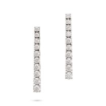 A PAIR OF DIAMOND DROP EARRINGS in 18ct white gold, each comprising a row of graduating round bri...