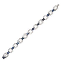 AN ART DECO SAPPHIRE AND DIAMOND BRACELET in platinum and white gold, comprising a row of geometr...