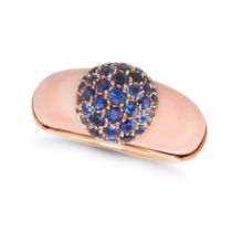 A CORAL AND SAPPHIRE RING in 18ct yellow gold, comprising a polished coral set with a cluster of ...