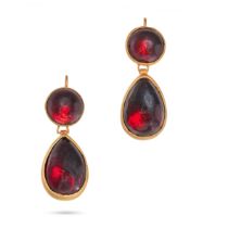 A PAIR OF GARNET DROP EARRINGS in yellow gold, each comprising a round cut garnet suspending a pe...