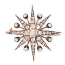 AN ANTIQUE DIAMOND STAR BROOCH / PENDANT in yellow gold and silver, designed as an eight rayed st...