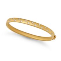 A DIAMOND BANGLE in 18ct yellow gold, the hinged bangle set with round brilliant cut diamonds, wi...