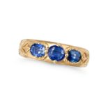 A SAPPHIRE THREE STONE RING in 18ct yellow gold, set with three oval cut sapphires, inscribed S1....