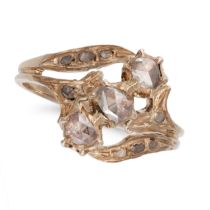 A DIAMOND RING in yellow gold, set with three rose cut diamonds, accented by further rose cut dia...