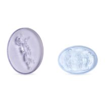 TWO PURPLE GLASS INTAGLIOS comprising a glass intaglio depicting Cupid shielding his eyes and hol...