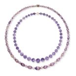 NO RESERVE - TWO AMETHYST AND GLASS NECKLACES in yellow gold, each comprising a row of faceted am...