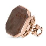 AN ANTIQUE SMOKEY QUARTZ FOB / SEAL set with an octagonal smokey quartz intaglio carved to depict...