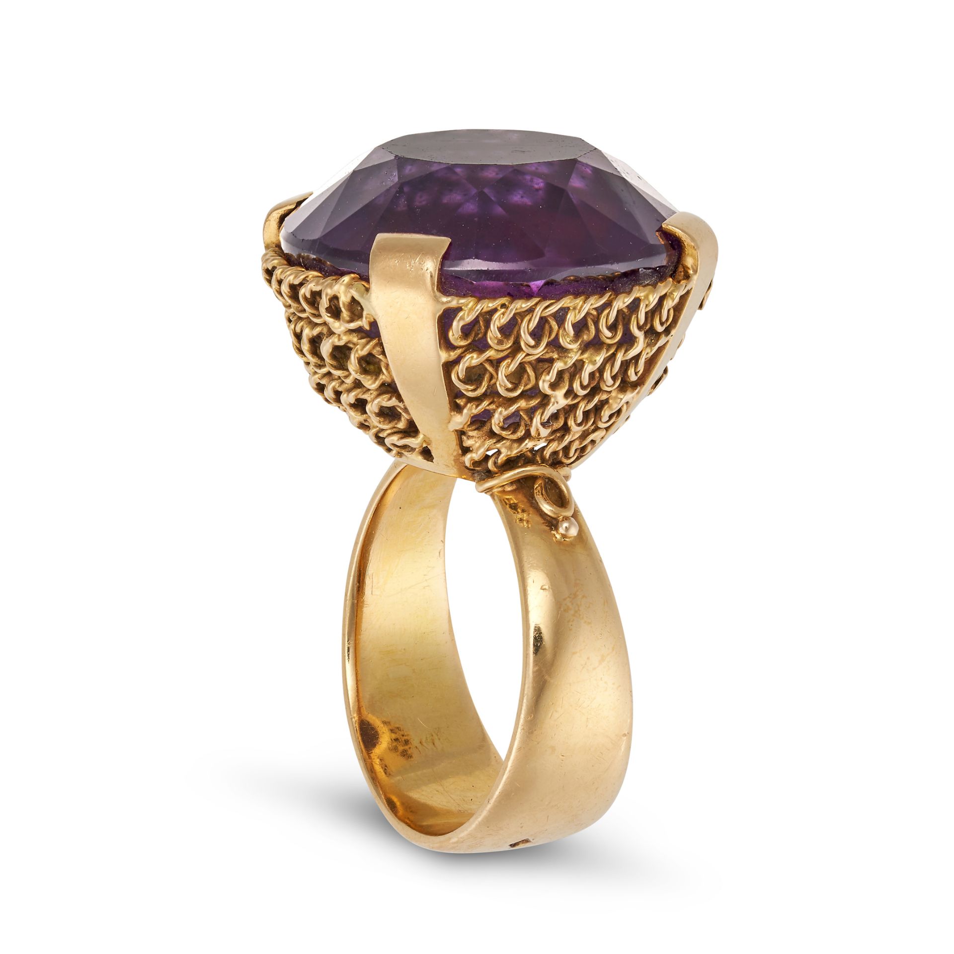 LUCIENNE LAZON, A VINTAGE AMETHYST COCKTAIL RING in 18ct yellow gold, set with a round cut amethy...