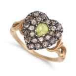 A PERIDOT AND DIAMOND HEART RING in yellow gold and silver, the heart shaped ring set with a pear...