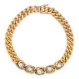 AN ANTIQUE PEARL AND DIAMOND CURB BRACELET in yellow gold, the central five links set with pearls...