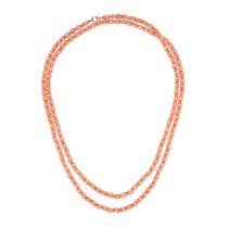 A CORAL AND GLASS BEAD NECKLACE in 9ct yellow gold, comprising a row of polished coral beads acce...