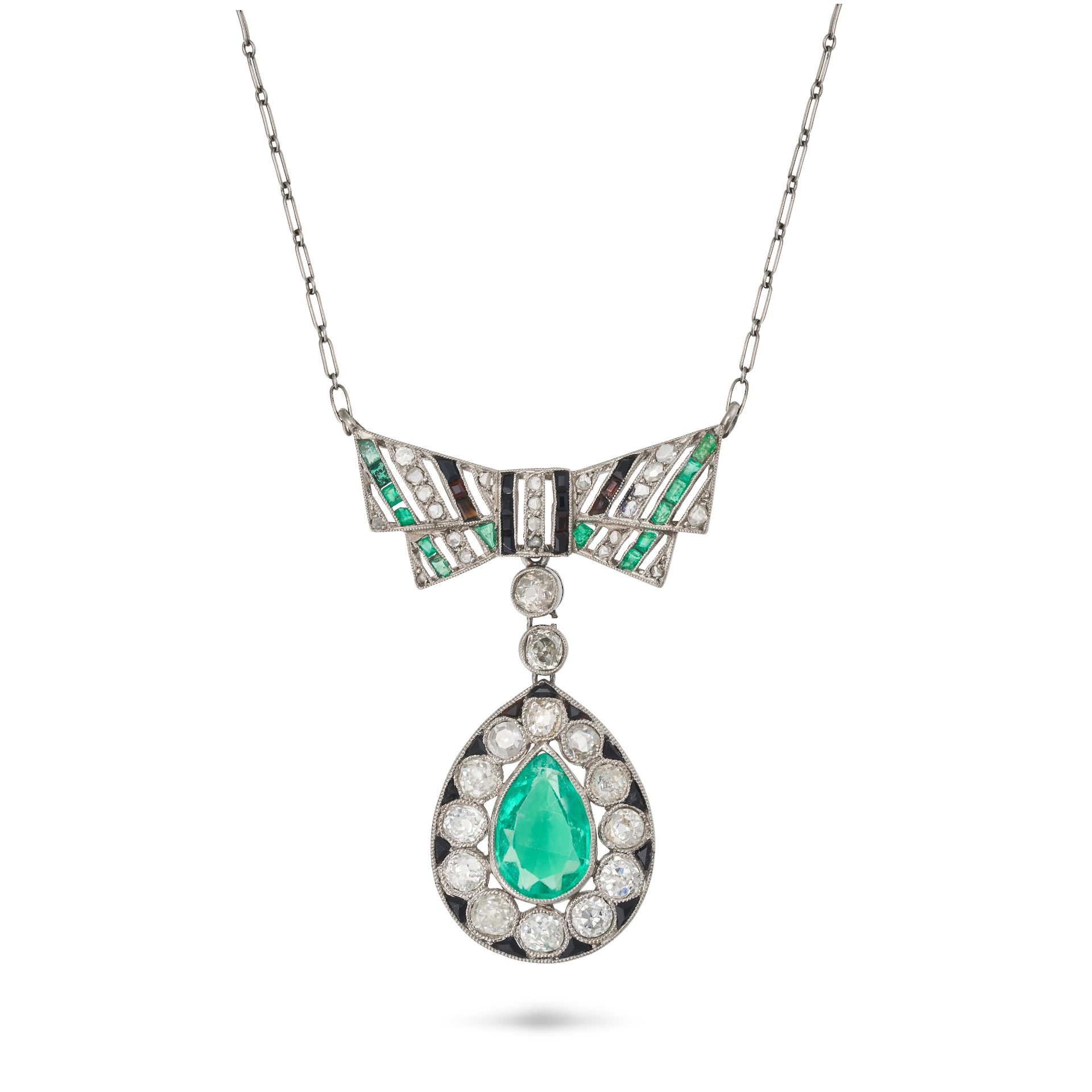 A FRENCH EMERALD, DIAMOND AND ONYX PENDANT NECKLACE in platinum, the pendant designed as a bow se...
