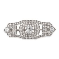 AN ANTIQUE ART DECO DIAMOND BROOCH in platinum, the geometric openwork brooch set to the centre w...