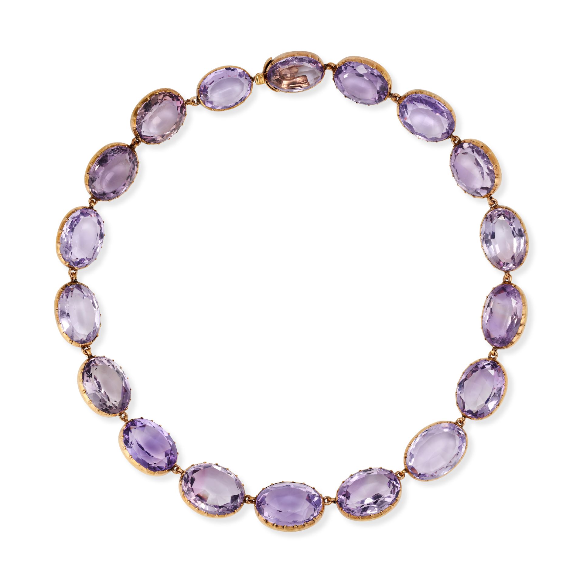 AN ANTIQUE VICTORIAN AMETHYST RIVIERE NECKLACE in yellow gold, comprising a single row of oval cu...
