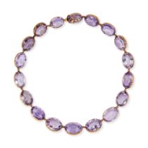 AN ANTIQUE VICTORIAN AMETHYST RIVIERE NECKLACE in yellow gold, comprising a single row of oval cu...