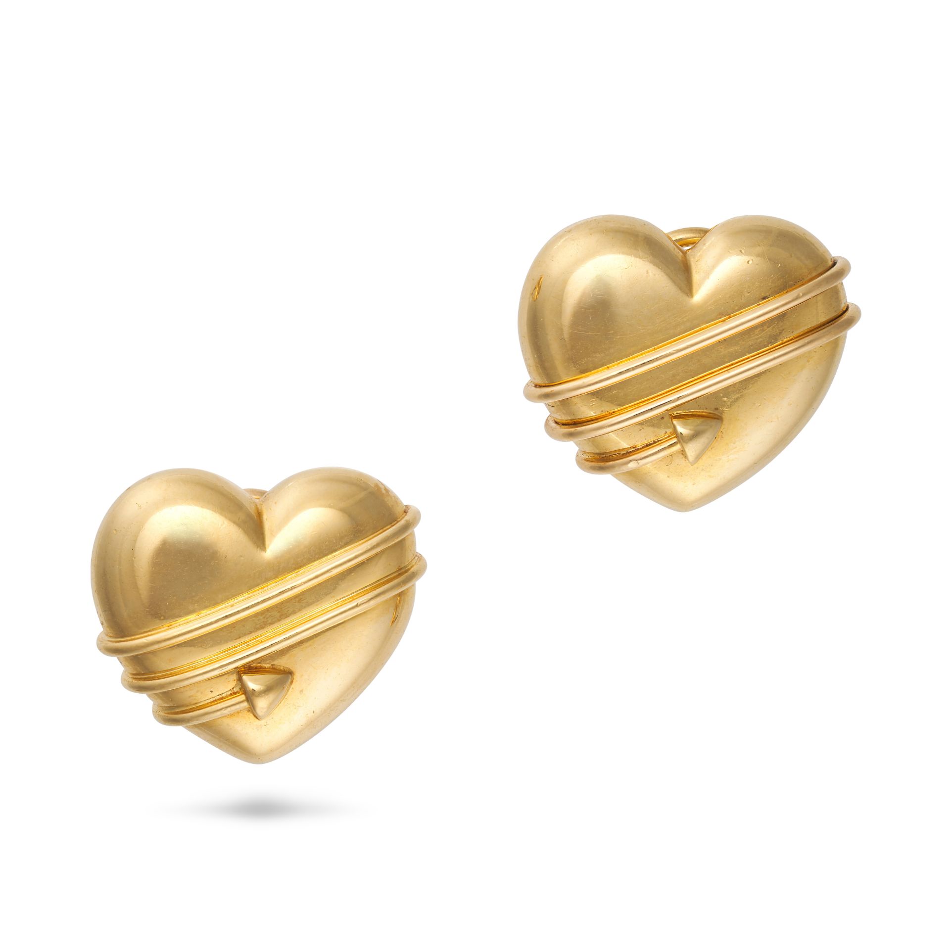 TIFFANY & CO., A PAIR OF CUPIDS ARROW HEART CLIP EARRINGS, 1994 in 18ct yellow gold, each designe...