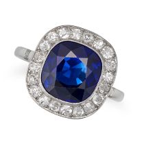 A FRENCH UNHEATED SAPPHIRE AND DIAMOND RING in platinum, set with a cushion cut sapphire of 4.80 ...