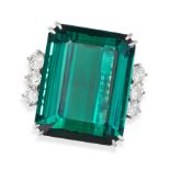 AN EXQUISITE GREEN TOURMALINE AND DIAMOND RING in platinum, set with an octagonal step cut green ...