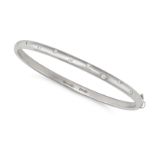 TIFFANY & CO., A DIAMOND ETOILE BANGLE in platinum, the hinged bangle set with staggered round br...