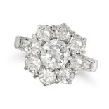A DIAMOND CLUSTER RING in white gold, set with a round brilliant cut diamond of approximately 0.9...