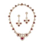 A RUBY AND DIAMOND NECKLACE AND EARRINGS SUITE in 18ct yellow gold, the necklace comprising a ser...