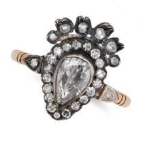 A DIAMOND SWEETHEART RING in yellow gold and silver, set with a pear shaped old cut diamond in a ...