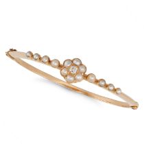 AN ANTIQUE PEARL AND DIAMOND BANGLE in yellow gold, the hinged bangle set with an old cut diamond...