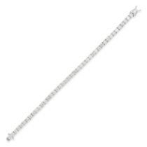 A DIAMOND LINE BRACELET in 18ct white gold, comprising a row of forty two round brilliant cut dia...