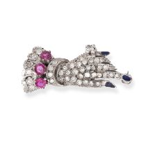 A DIAMOND, RUBY AND ENAMEL HAND BROOCH in white gold, designed as a hand set throughout with sing...