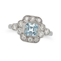 AN AQUAMARINE AND DIAMOND RING in platinum, set with an octagonal step cut aquamarine, accented b...