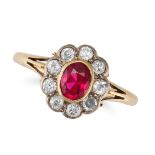 A SYNTHETIC RUBY AND DIAMOND CLUSTER RING in 18ct yellow gold, set with an oval cut synthetic rub...