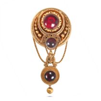 AN ANTIQUE GARNET BROOCH in yellow gold, the circular brooch set with two round cabochon garnets,...