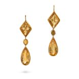 A PAIR OF YELLOW TOPAZ DROP EARRINGS in yellow gold, each set with a fancy cut topaz, suspending ...
