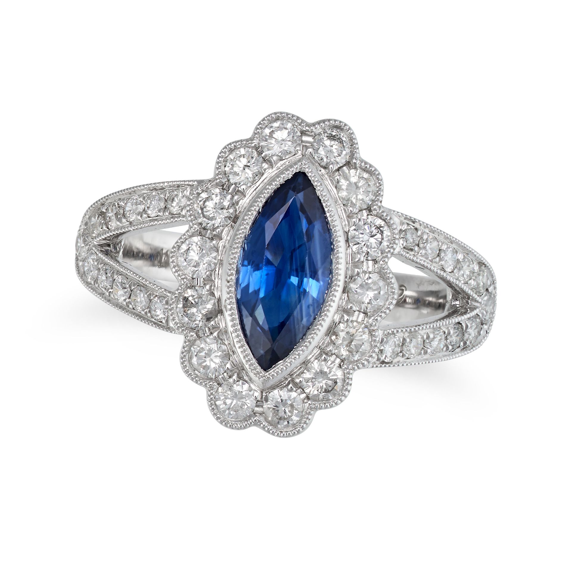A SAPPHIRE AND DIAMOND CLUSTER RING in 18ct white gold, set with a marquise cut sapphire of appro...