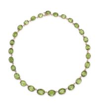 AN ANTIQUE GREEN PASTE RIVIERE NECKLACE in yellow gold, comprising a row of graduating oval cut g...
