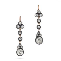 A PAIR OF DIAMOND DROP EARRINGS in yellow gold and silver, each comprising a trio of old cut diam...
