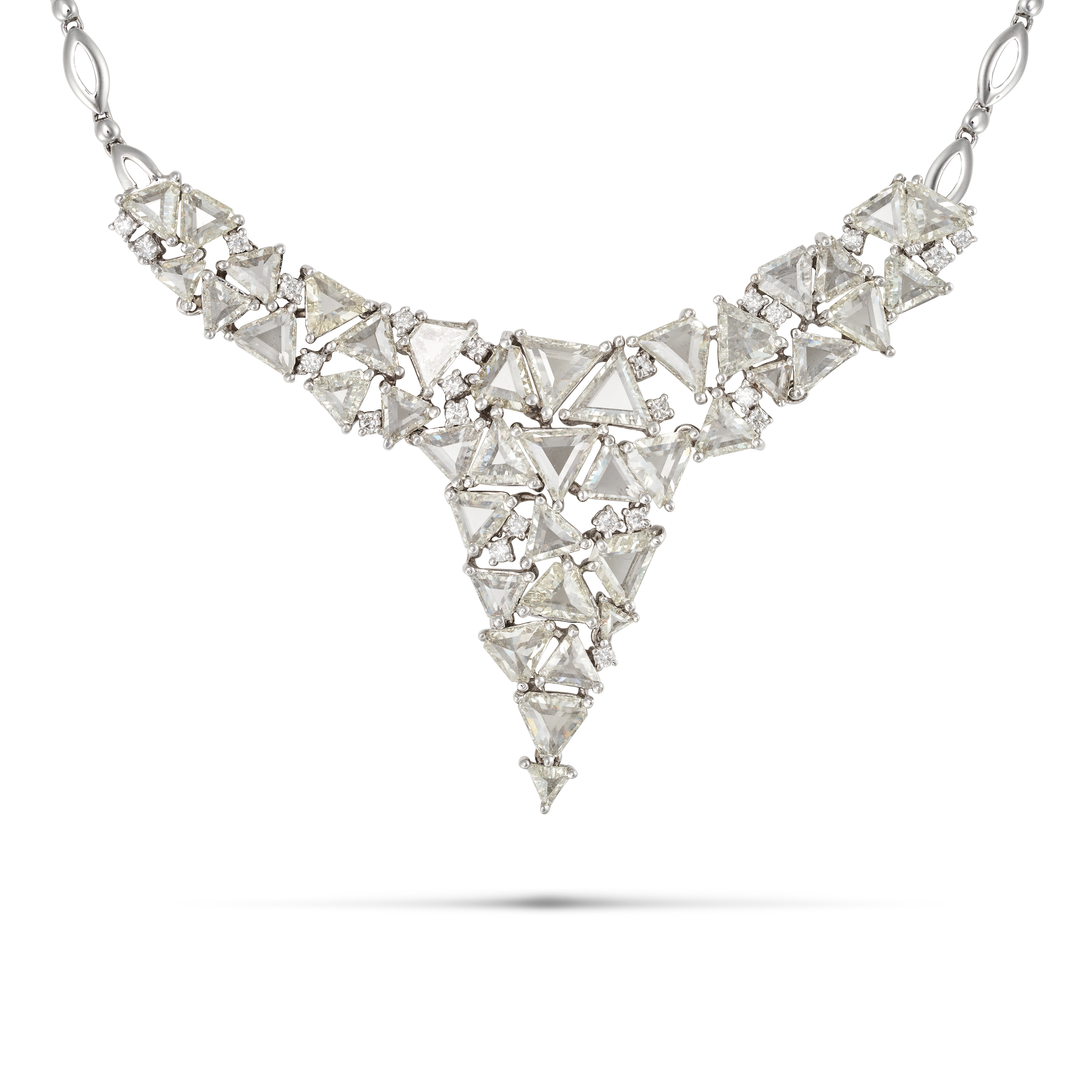 A DIAMOND NECKLACE in 18ct white gold, comprising a cluster of trillion cut diamonds, accented by...