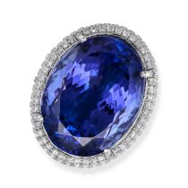 A TANZANITE AND DIAMOND RING in 18ct white gold, set with an oval cut tanzanite of 35.38 carats i...