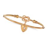 AN ANTIQUE DIAMOND LOVERS KNOT BANGLE in 9ct yellow gold, the hinged bangle comprising a lover's ...