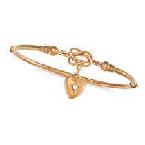 AN ANTIQUE DIAMOND LOVERS KNOT BANGLE in 9ct yellow gold, the hinged bangle comprising a lover's ...